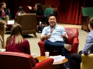 People sitting in chairs talking