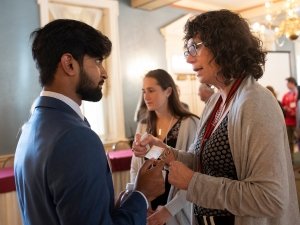 Student and alumna talking
