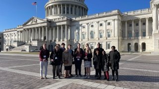 Students standing in front of the U.S. Capitol building in Washington D.C.